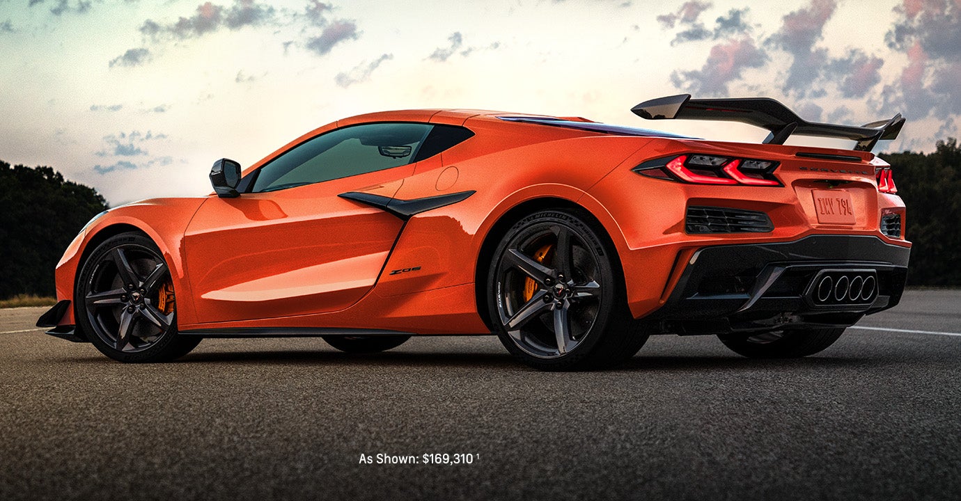 Orange Chevrolet Corvette Z06 sports car on the road.